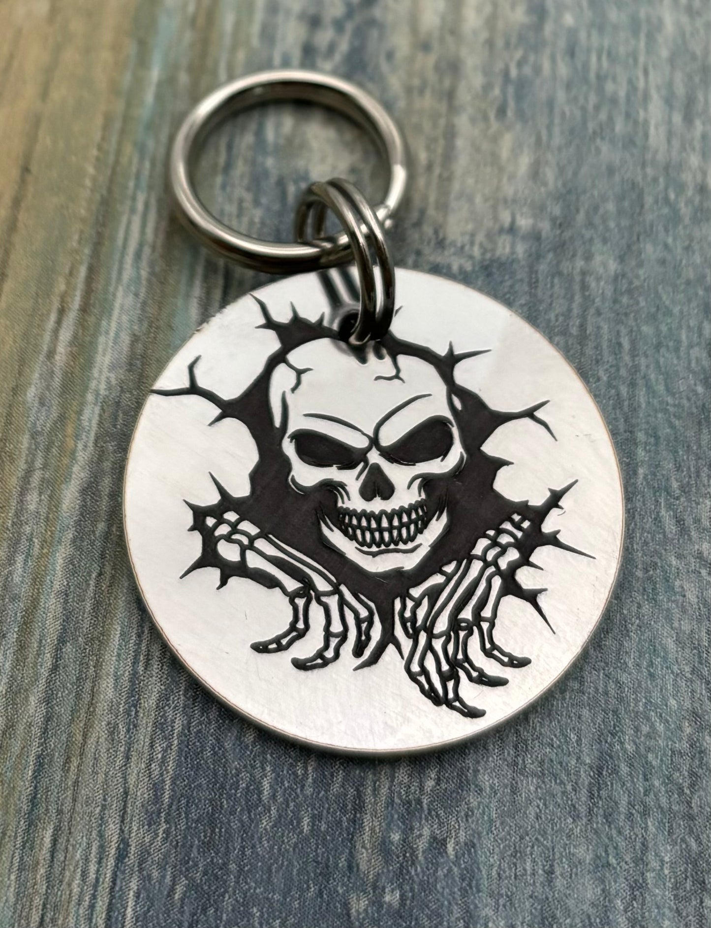 Skull breaking through wall pet id tag