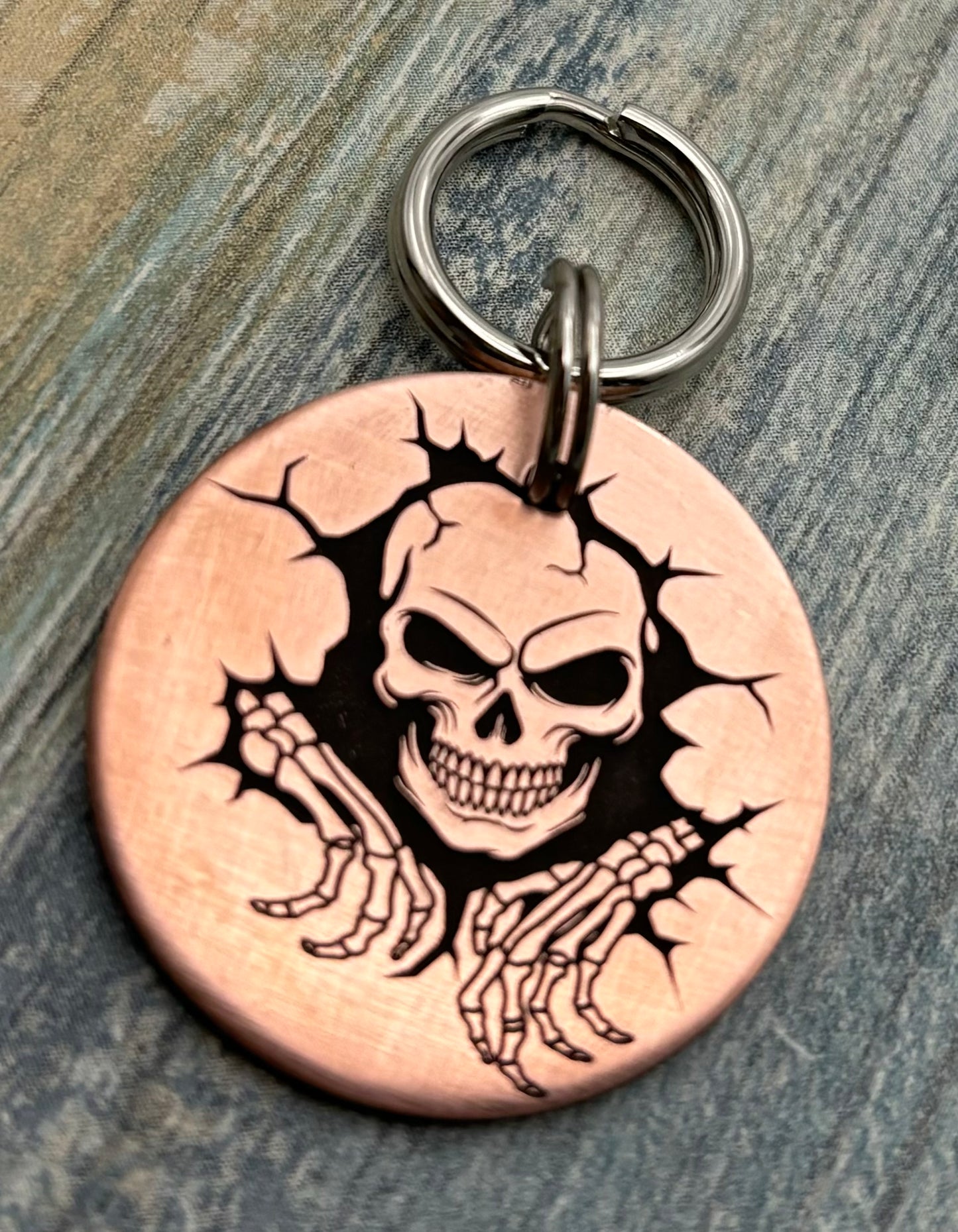 Skull breaking through wall pet id tag